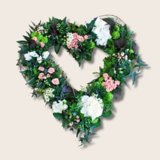 Open textured heart with natural foliage and touches of pure white and light pink florals. 