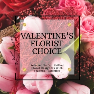 Valentine's Florist Choice Bouquet featuring a red rose and seasonal blooms in a romantic colour palette. Hand-tied and presented in a signature gift bag in water.